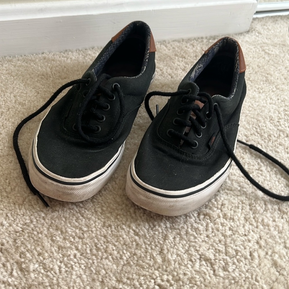 Black Vans with leather detailing